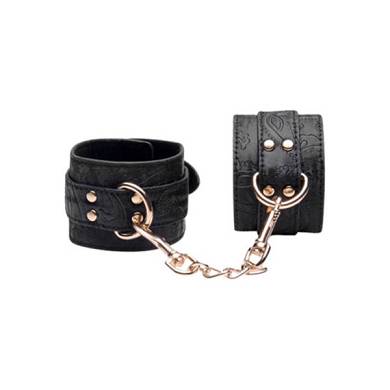 Handfesseln mit Stickereien in Schwarz