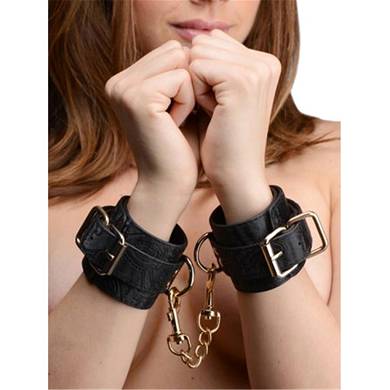 Handfesseln mit Stickereien in Schwarz