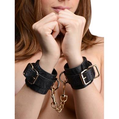 Handfesseln mit Stickereien in Schwarz
